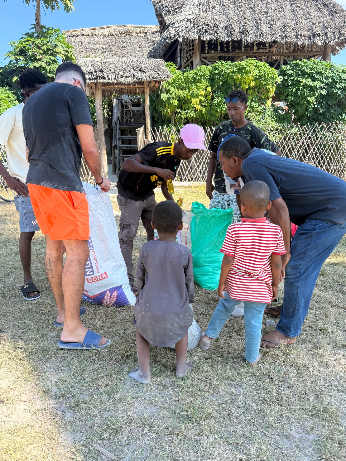 Yasir taking part in a community visit with children in Zanzibar