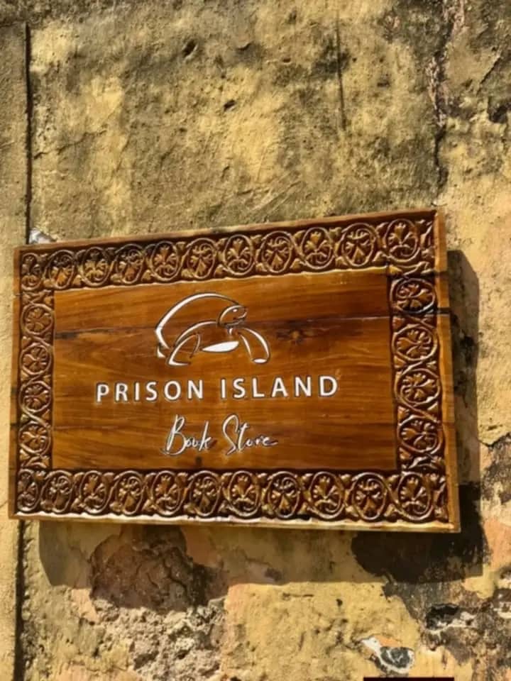Carved wooden Prison Island sign