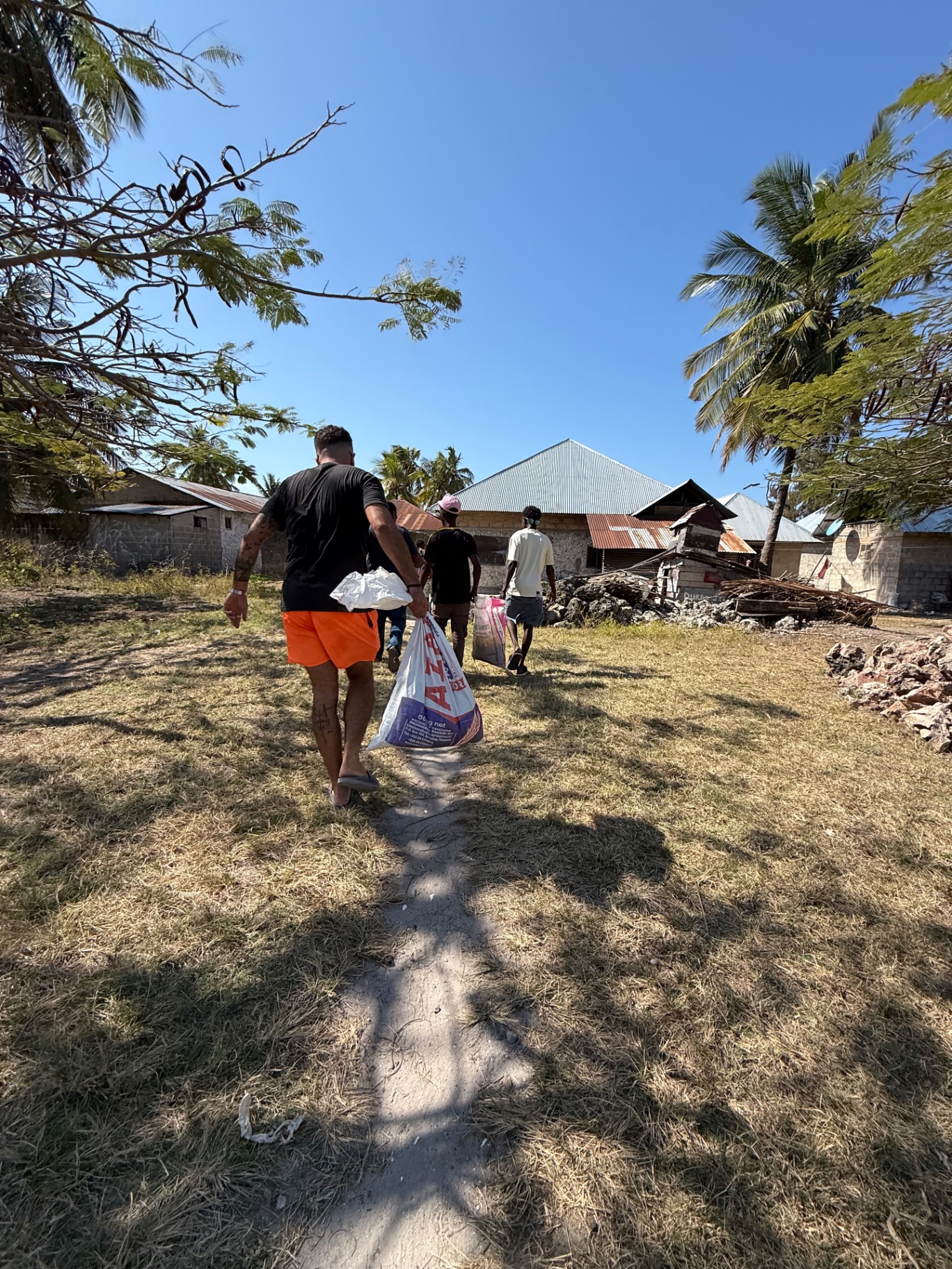 Community members walking together during local support work